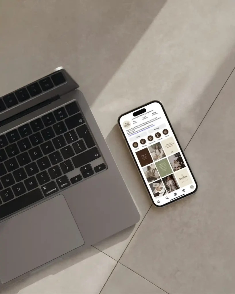 Best Social media marketer in bahrain workspace with laptop and smartphone displaying a professional Instagram business profile and branded content